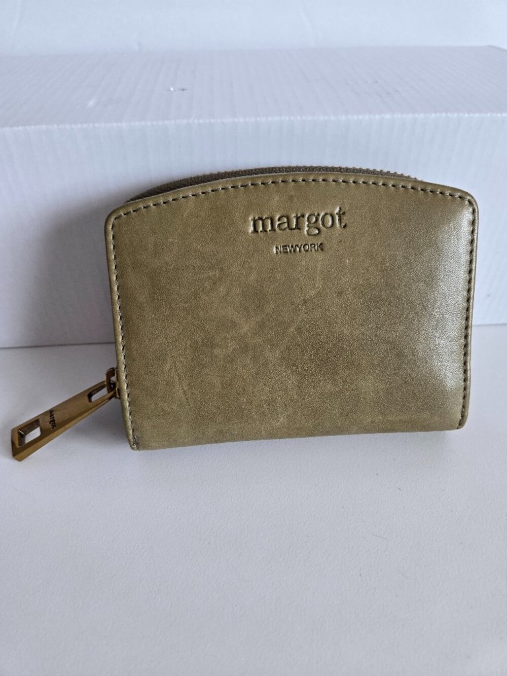 Margot leather bi-fold wallet Olive colour with embossed logo on front